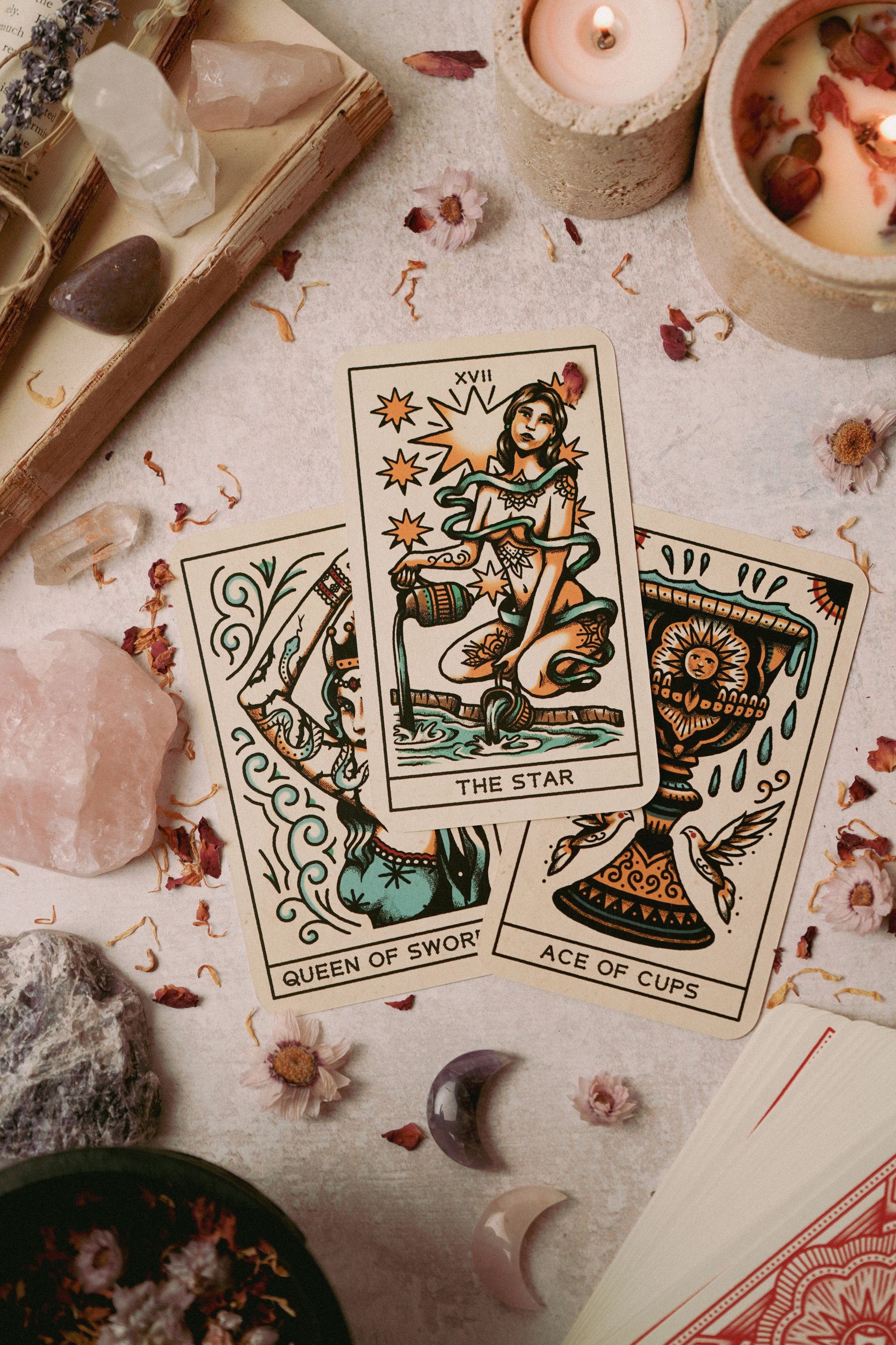 Tarot cards arranged with crystals in a flatlay photograph